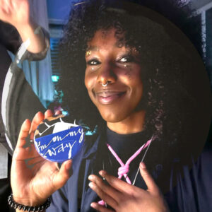 A proud participant showing off a badge saying I'm On My Way