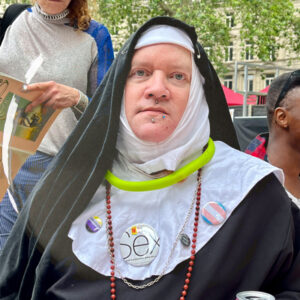 Mother Mandragora of the Sisters of Perpetual Indulgence wearing a badge saying Sex